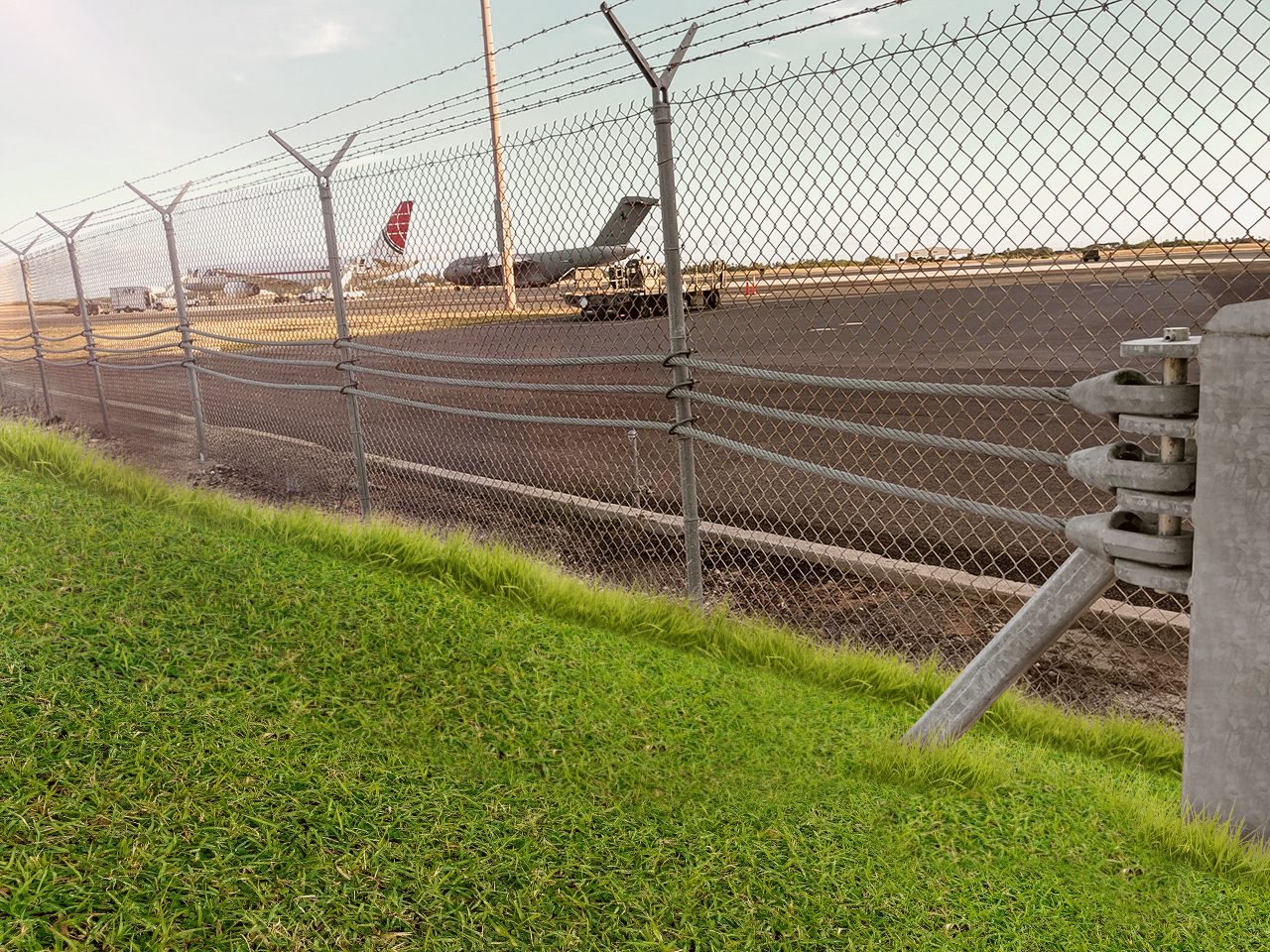 SW1200 post and cable barrier along an airport perimeter